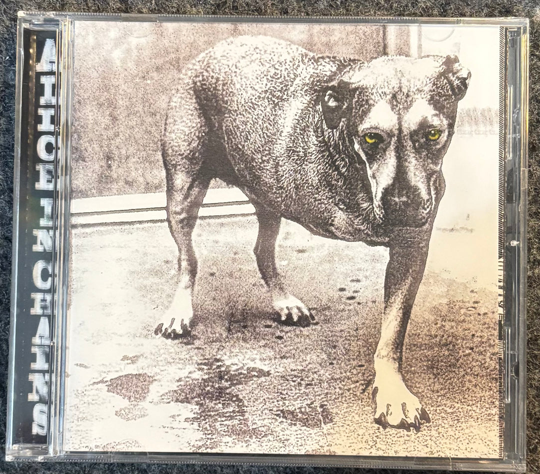 ALICE IN CHAINS – ALICE IN CHAINS (3 LEGGED DOG) CD cover with a dog illustration and 'Alice in Chains' text