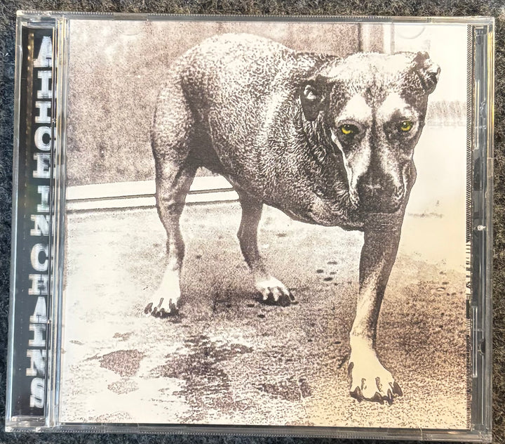 ALICE IN CHAINS – ALICE IN CHAINS (3 LEGGED DOG) CD cover with a dog illustration and 'Alice in Chains' text