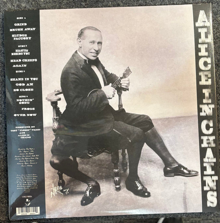Album cover of Alice in Chains with a black and white photo of a man sitting on a chair.
