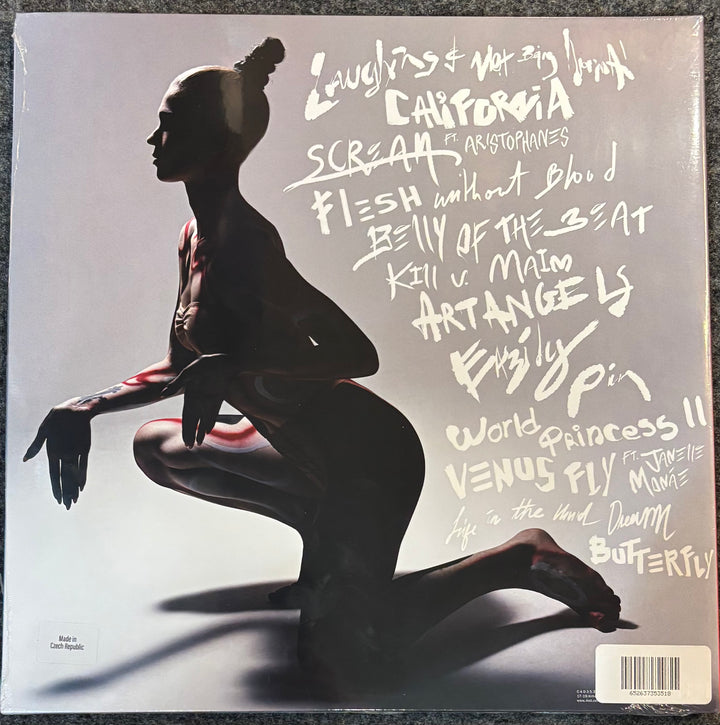 Grimes - Art Angels cover with a silhouette of a dancer and stylized text on a gray background