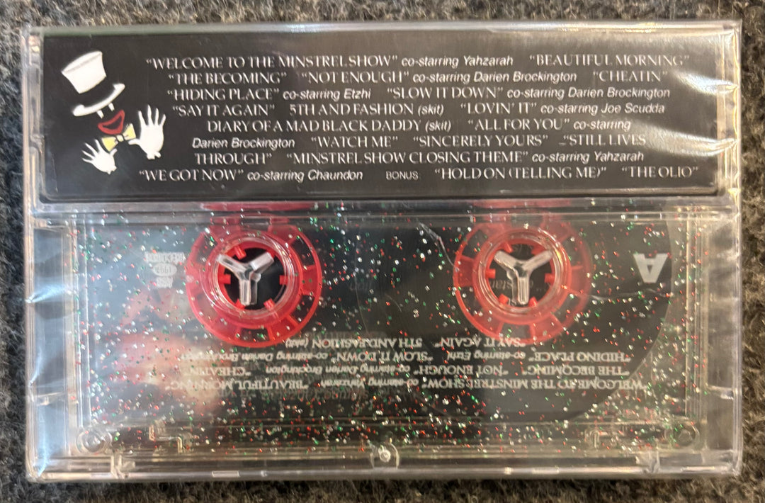 LITTLE BROTHER - THE MINSTREL SHOW Cassette tape with visible label and red labels on a dark surface