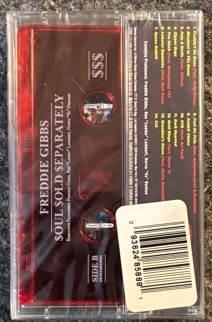 GIBBS, FREDDIE - $OUL $OLD $EPARATELY tape with red label and clear casing on a textured surface