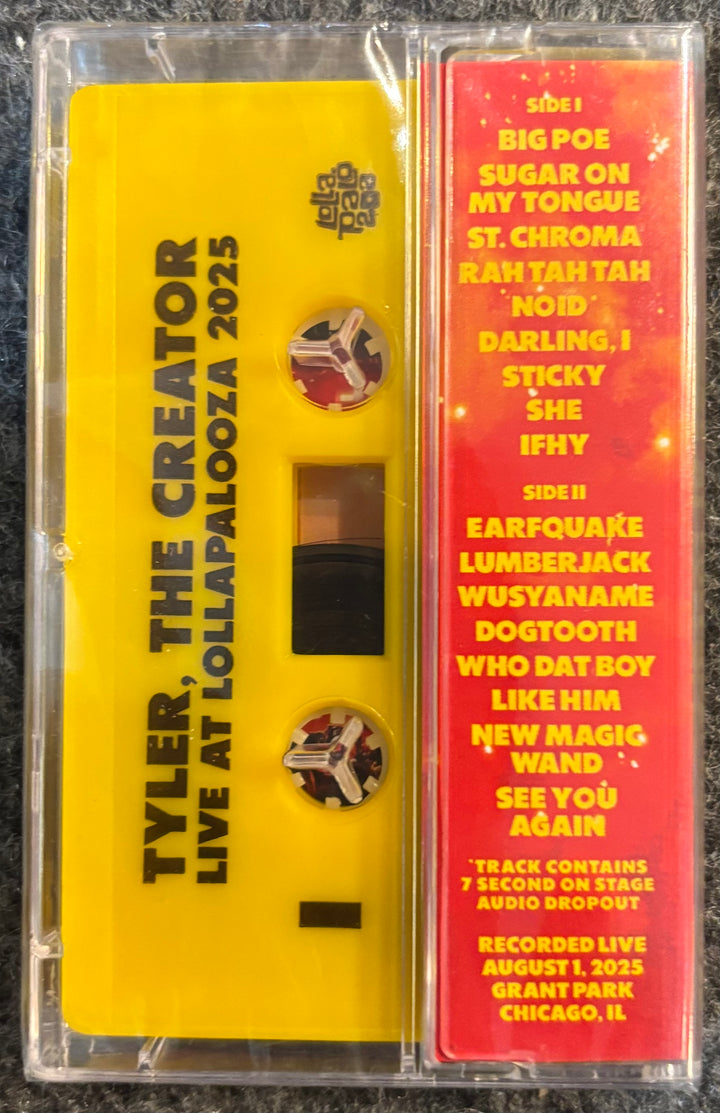 TYLER, THE CREATOR - LIVE AT LOLLAPALOOZA Cassette tape with yellow label and red text on a black background