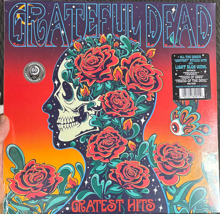Grateful Dead - Gratest Hits record cover with colorful design and 'Grateful Dead' branding