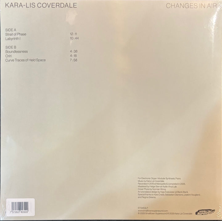 The back cover of a vinyl record sleeve for Kara-Lis Coverdale's album 'Changes in Air', showing track listings, barcode, and publisher details on a warm beige background.