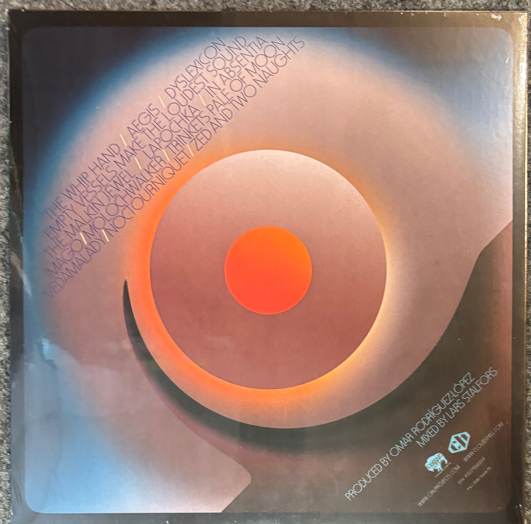 THE MARS VOLTA - NOCTOURNIQUET record with a spiral design and text on a reflective surface
