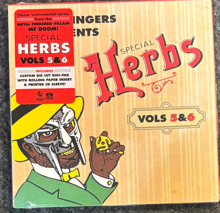 Metal Fingers (MF DOOM) - Special Herbs Vol. 5 & 6, featuring a vintage-style illustration of a masked figure in a yellow hat and green suit on a tan wood-grain background, with a red sticker on the top left.