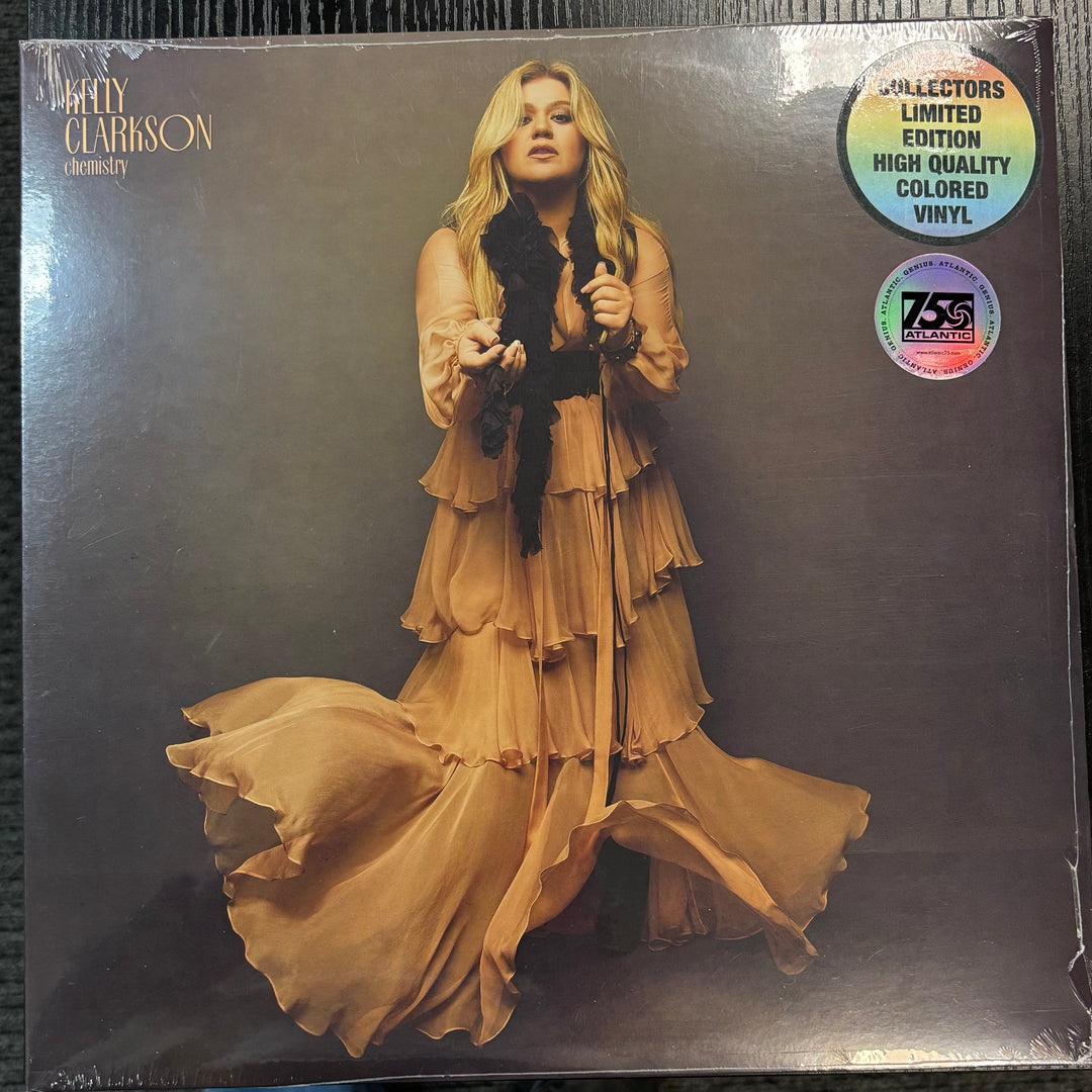 CLARKSON, KELLY - Chemistry record cover with a woman in a flowing dress on a dark background