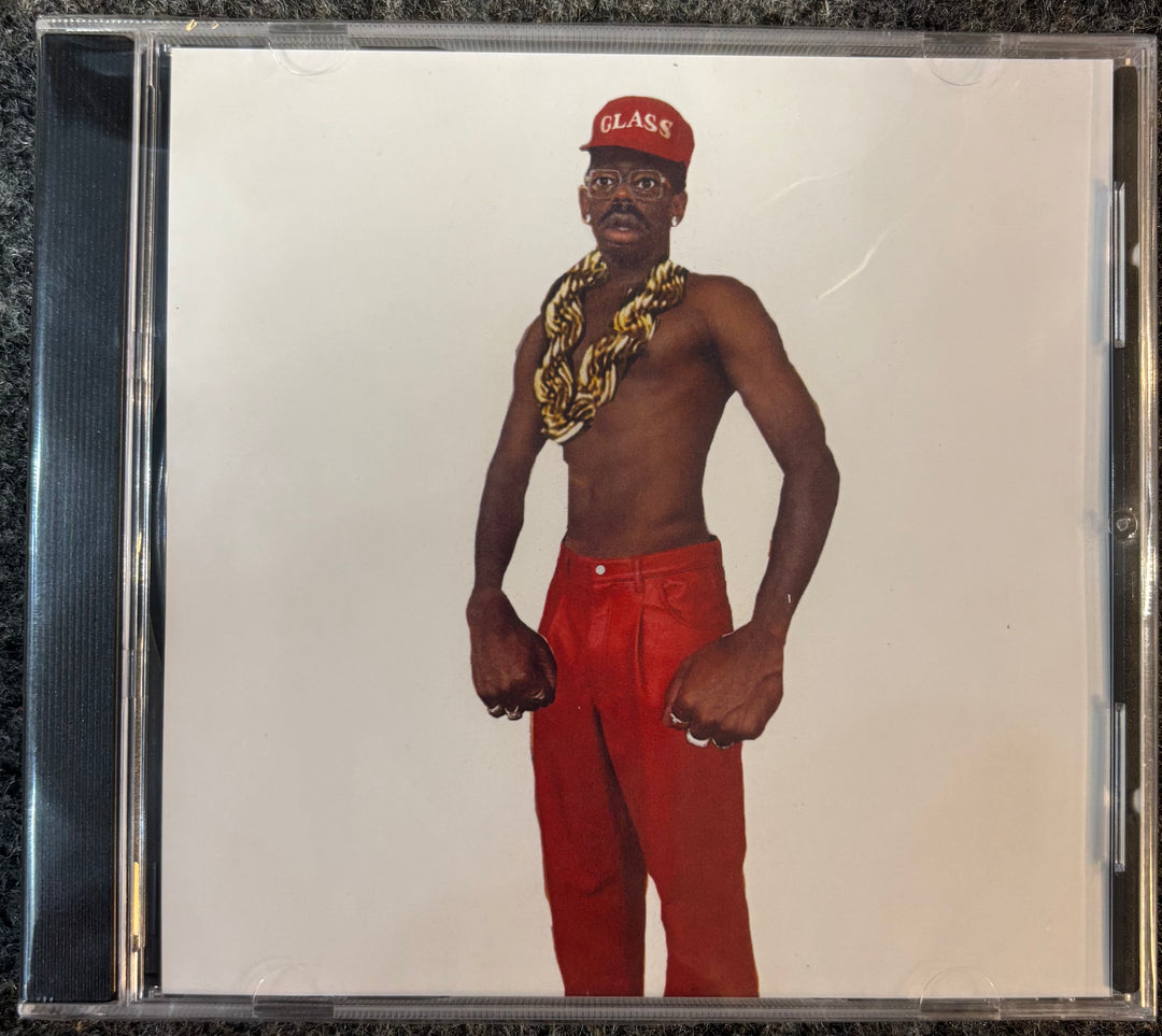 TYLER, THE CREATOR - DON'T TAP THE GLASS CD cover with a person wearing a red cap, gold chain, and red pants on a plain background
