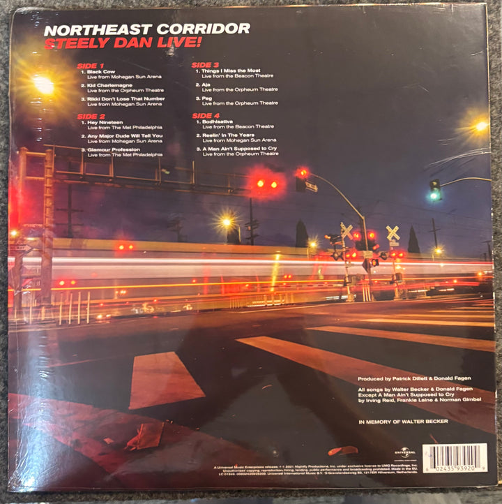 STEELY DAN - Northeast Corridor record cover with a nighttime city street scene and album details.