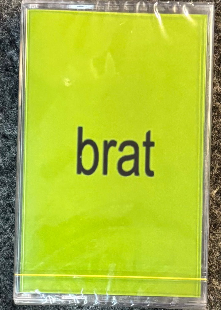 CHARLIE XCX - BRAT tape with 'brat' text on a yellow background