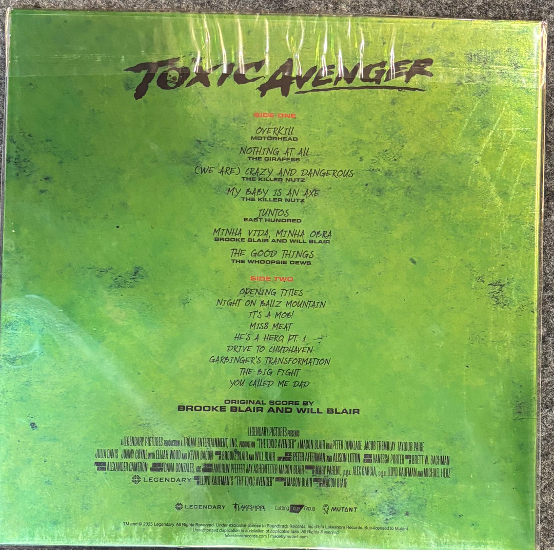 Back cover of THE TOXIC AVENGER – O.S.T. with tracklist and branding on a green textured background
