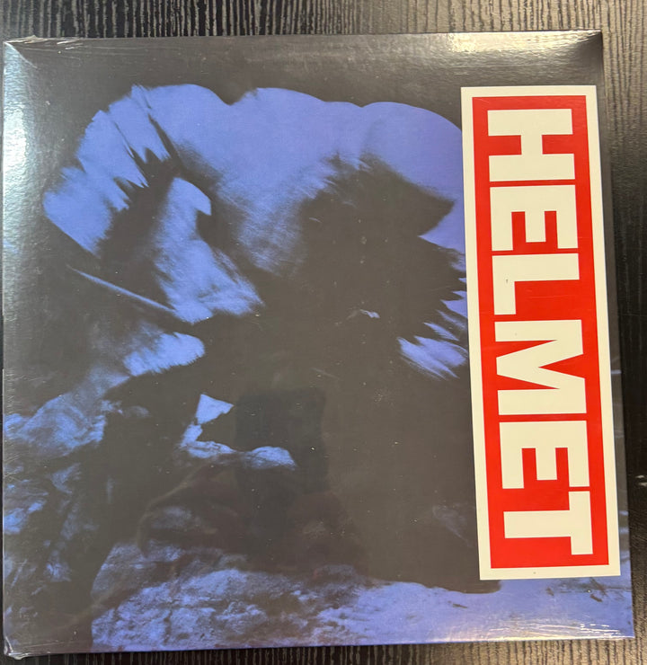 Album cover with a blue abstract design and 'HELMET' text on a red background