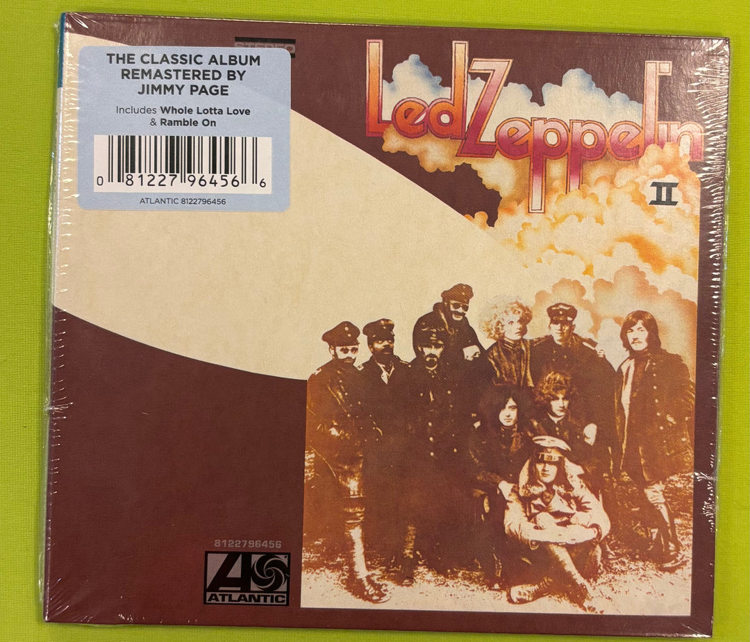 Led Zeppelin II album cover with band members and cloud design on a green background