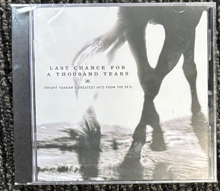 CD cover for Dwight Yoakum 'Last Chance for a Thousand Years' on a textured surface