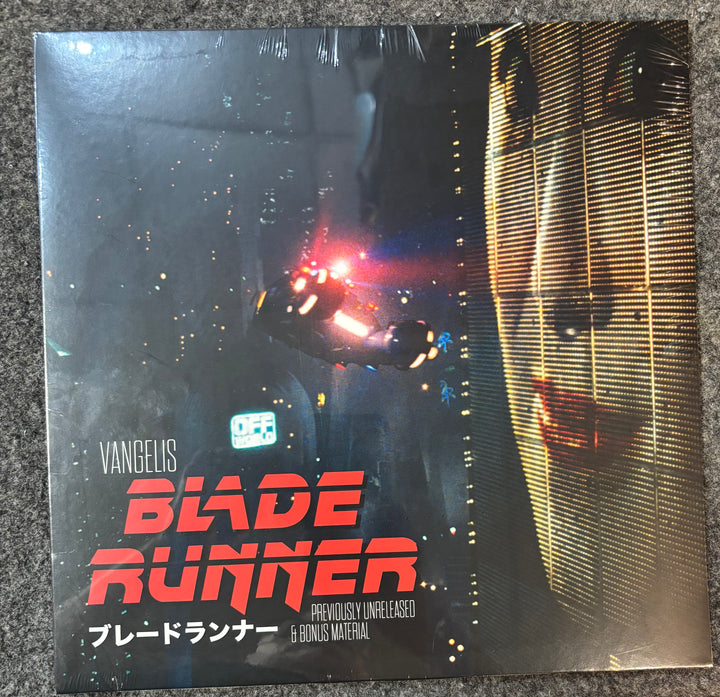 Vinyl record cover for 'Blade Runner' by Vangelis on a textured surface