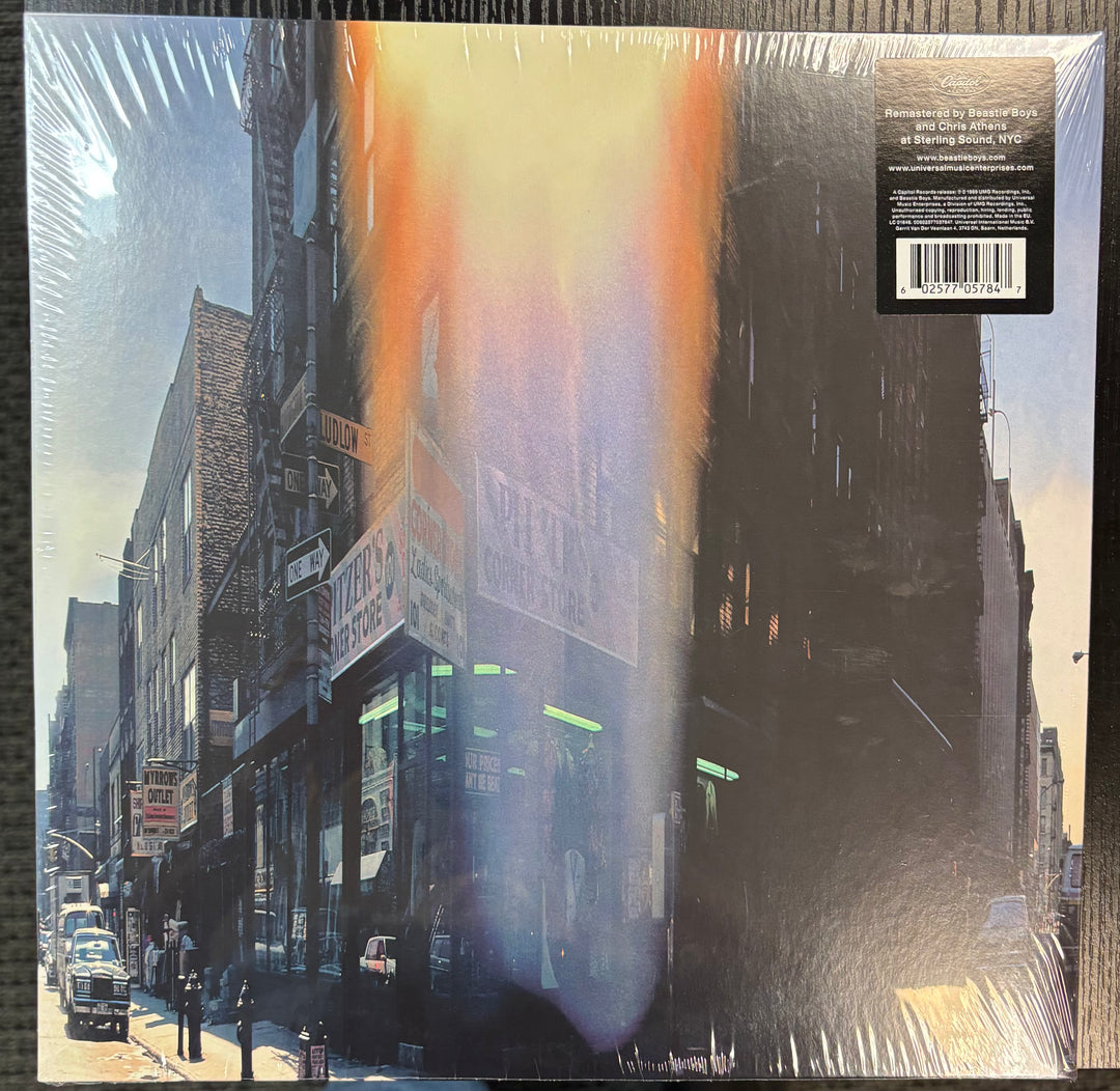 Beastie Boys ‎– Paul's Boutique record cover with a city street scene and reflective surface