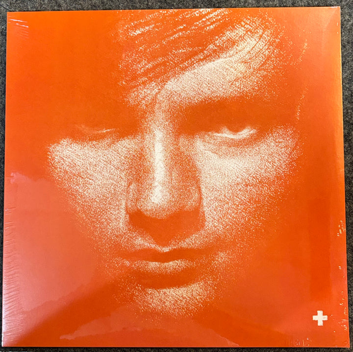 SHEERAN, ED – Plus + Artistic depiction of a face on an orange background