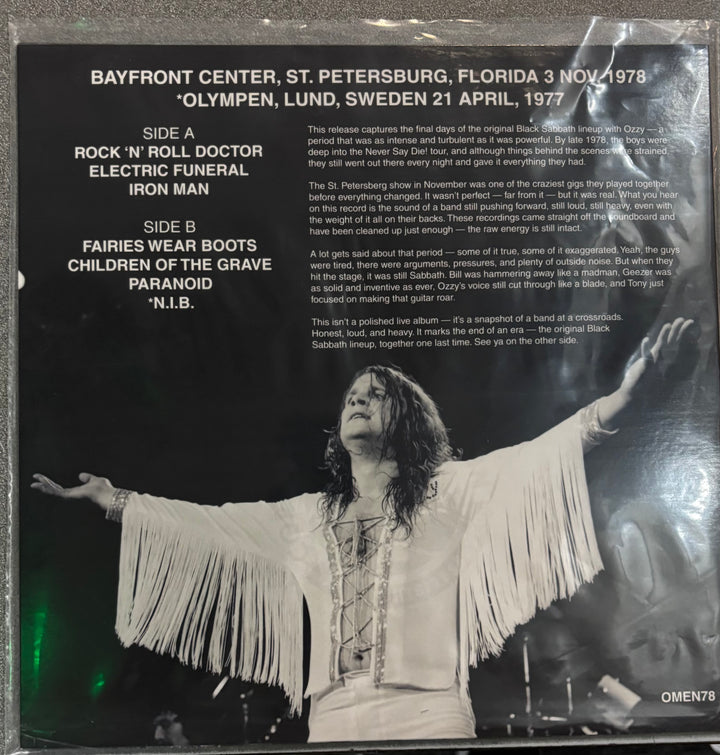 BLACK SABBATH - THE OMEN Album cover with a black and white photo of a person with outstretched arms, text on a dark background