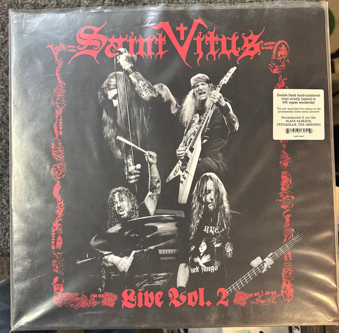 Vinyl record cover for 'Saint Vitus Live Vol. 2' with band members and decorative elements.