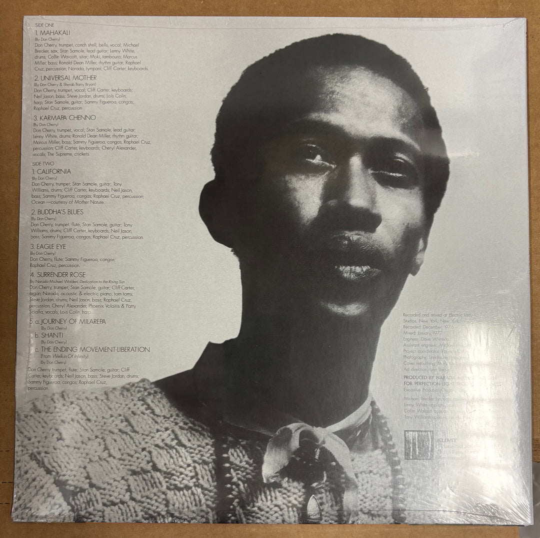 Album cover with a black and white portrait of a person on the right side and text on the left side.