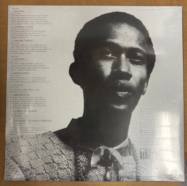 Album cover with a black and white portrait of a person on the right side and text on the left side.