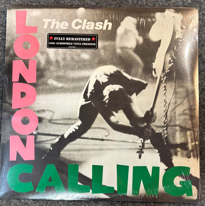 Vinyl record cover for 'London Calling' by The Clash with a statue and text.