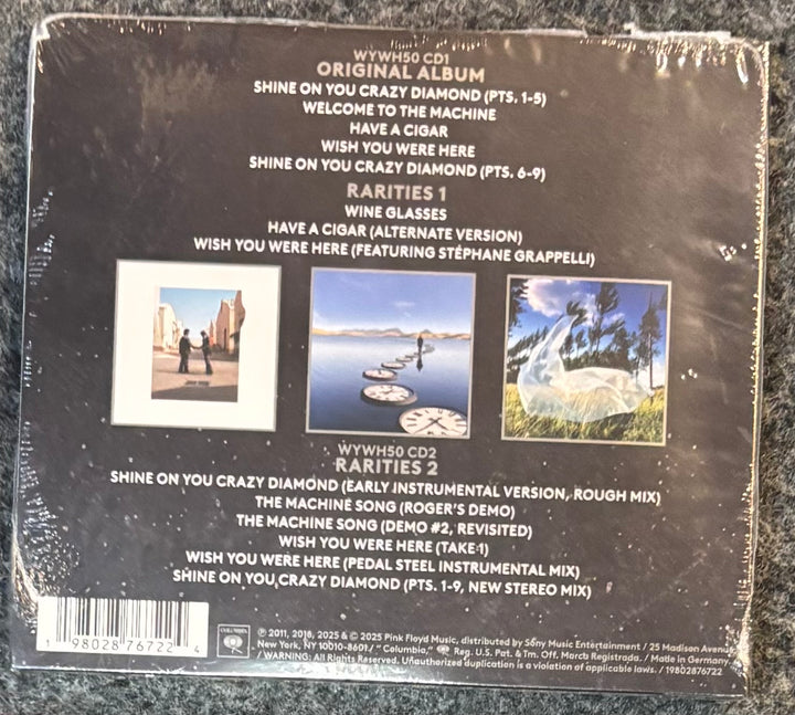 Back cover of PINK FLOYD - WISH YOU WERE HERE with tracklist and images on a textured surface