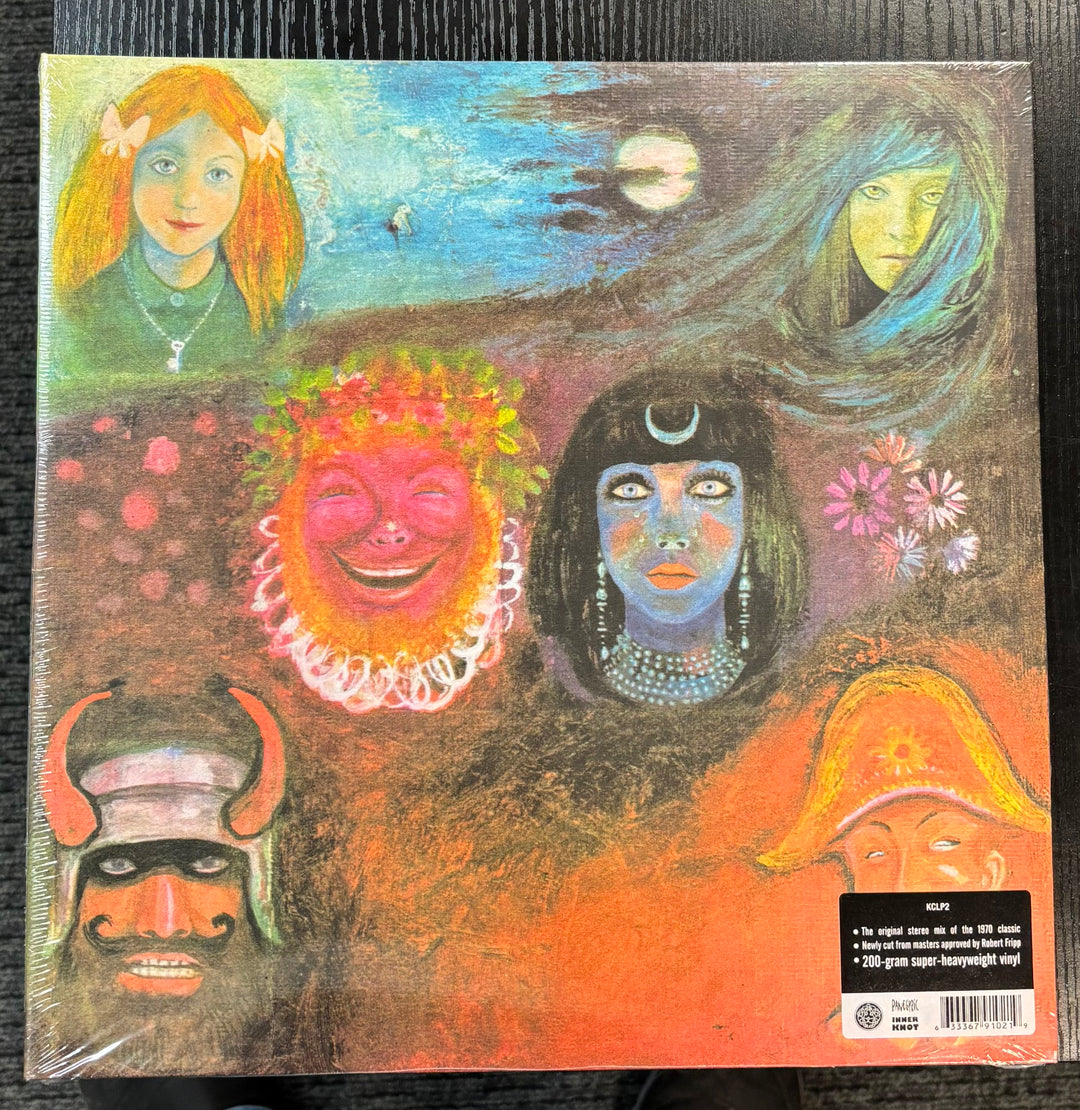 KING CRIMSON – In The Wake Of Poseidon album cover with stylized faces and abstract designs