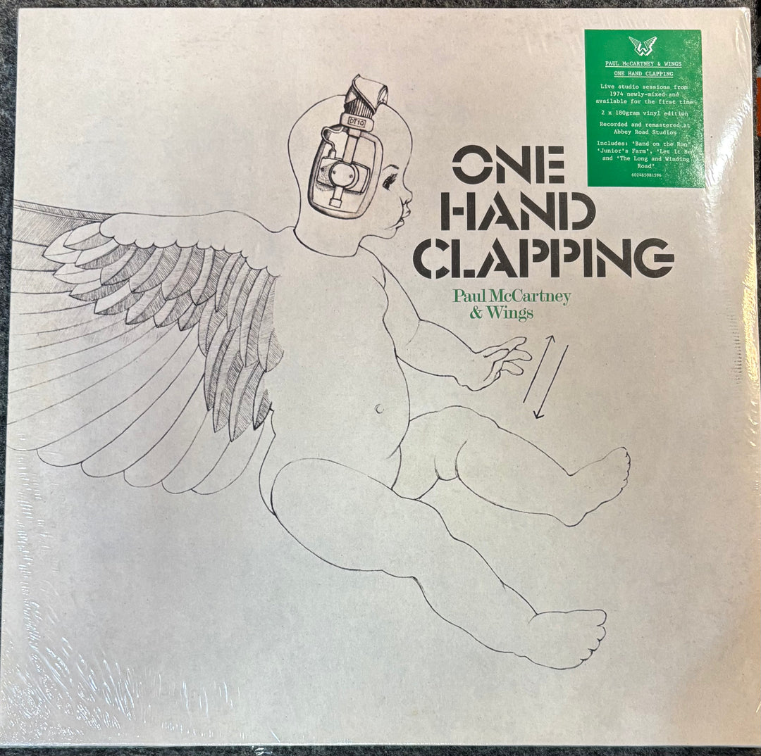 Vinyl record cover for 'One Hand Clapping' by Paul McCartney & Wings with a child illustration.