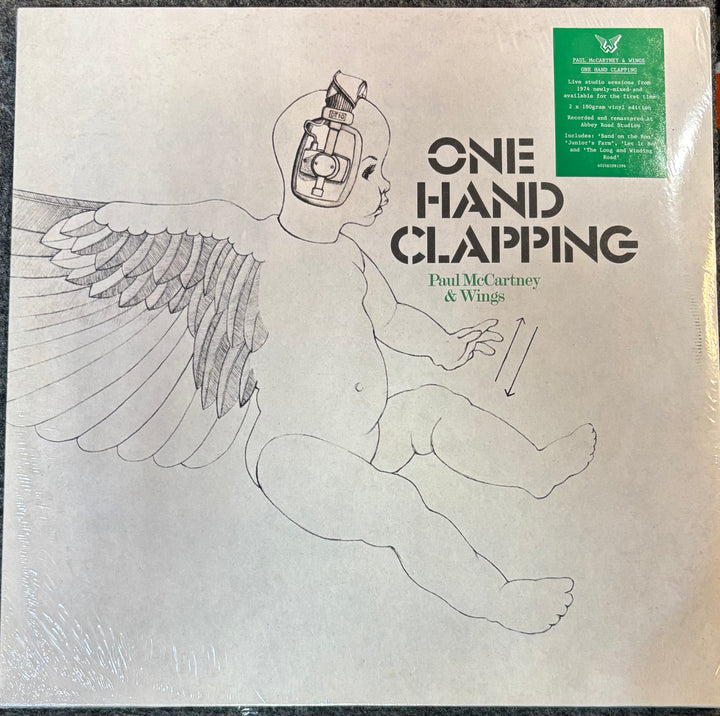 Vinyl record cover for 'One Hand Clapping' by Paul McCartney & Wings with a child illustration.