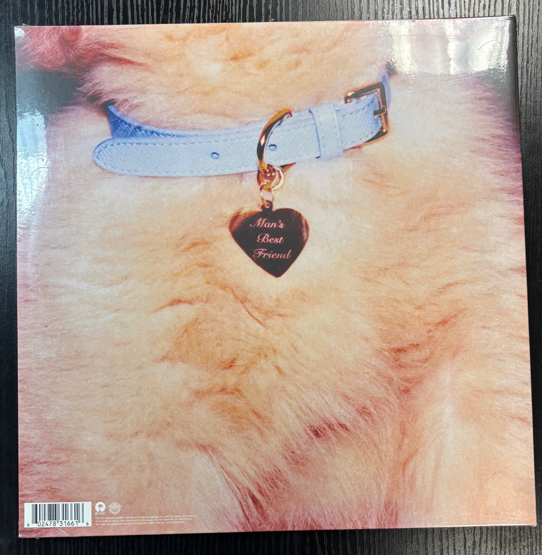 Sabrina Carpenter 'Man's Best Friend' tag on a textured surface.