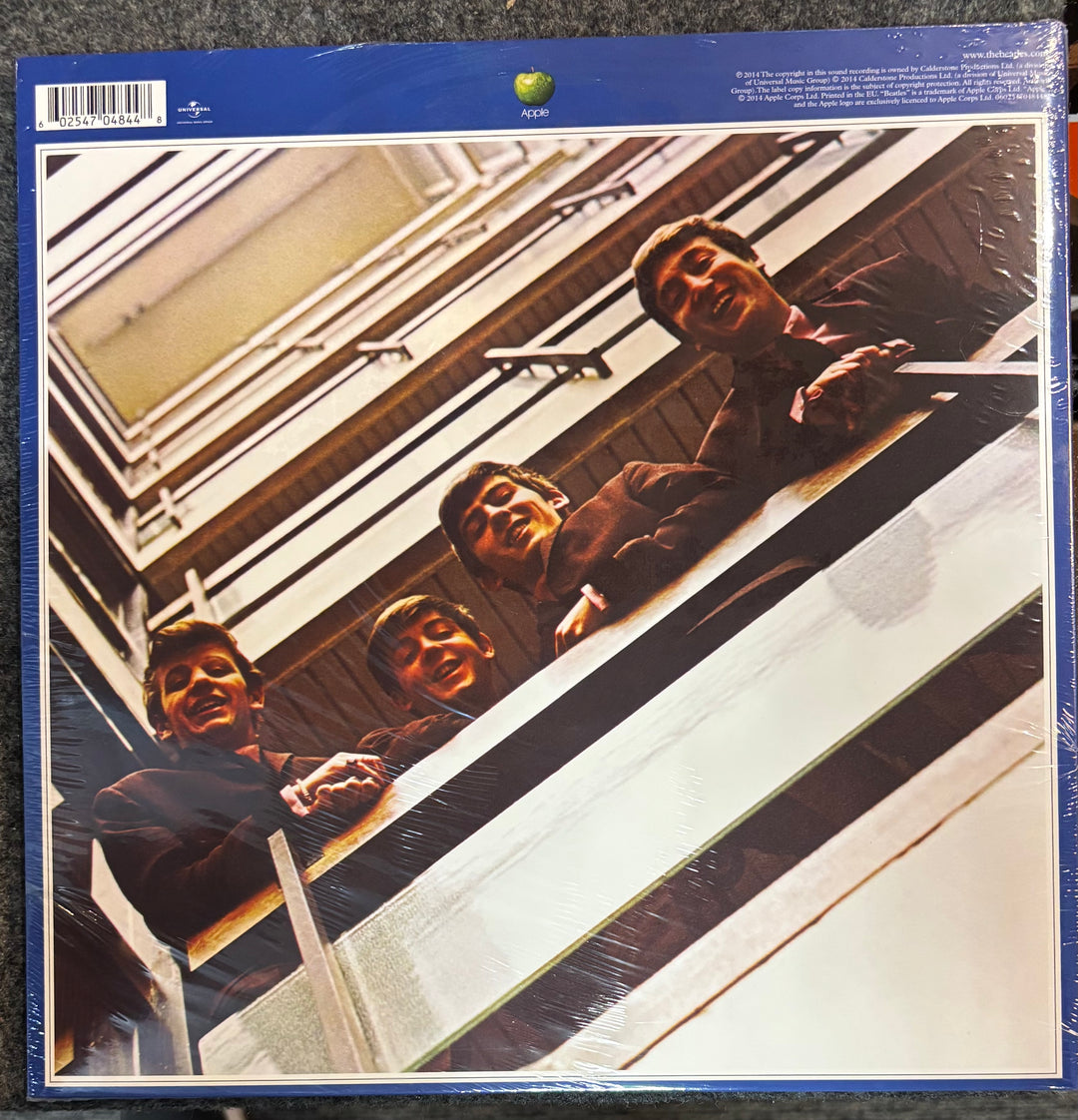 The Beatles – 1967-1970 cover with a stylized depiction of four men looking out a window.