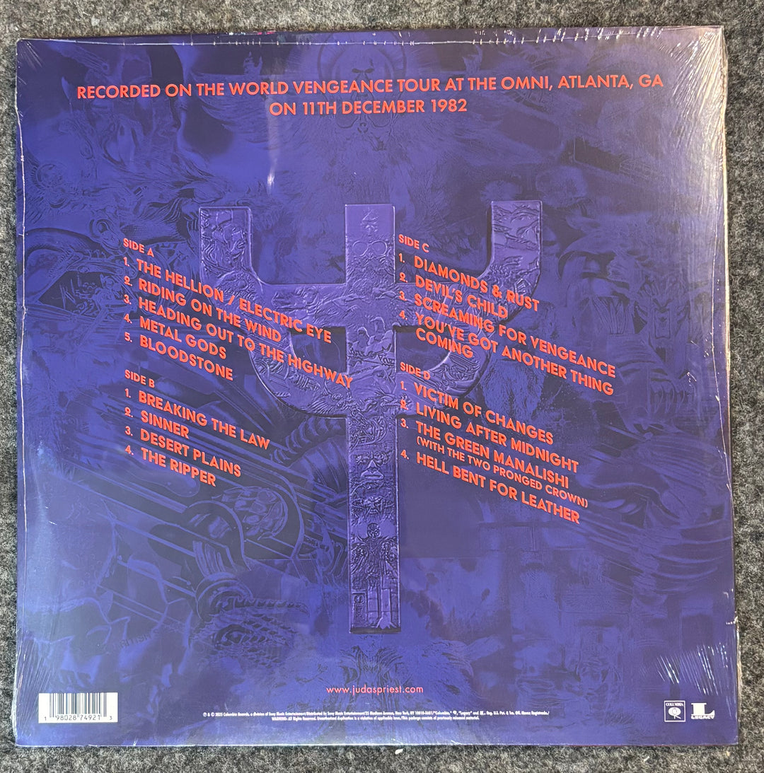 Back cover of JUDAS PRIEST - LIVE IN ATLANTA '82 with text and design elements on a blue background