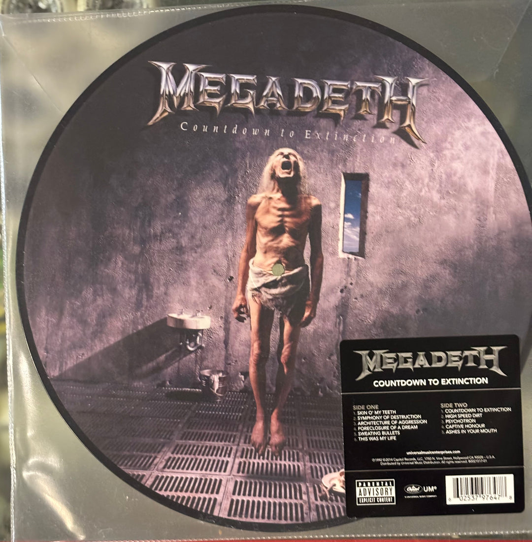 Vinyl record cover for Megadeth's 'Countdown to Extinction' with a person in a room.