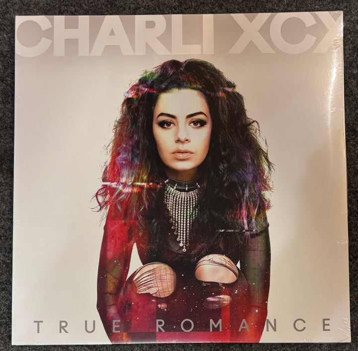CHARLI XCX - TRUE ROMANCE Album cover with a person and 'Charli XCX True Romance' text