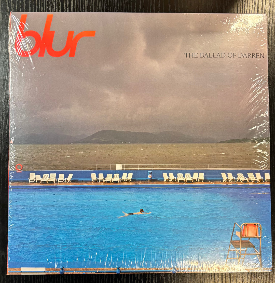 Album cover of 'The Ballad of Darren' by Blur with a person swimming in a pool.