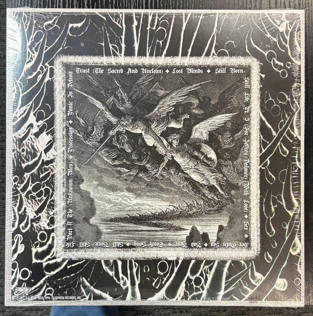 CHRISTIAN DEATH - Rage Of Angels cover with a central illustration of an angel and devil, surrounded by intricate patterns.