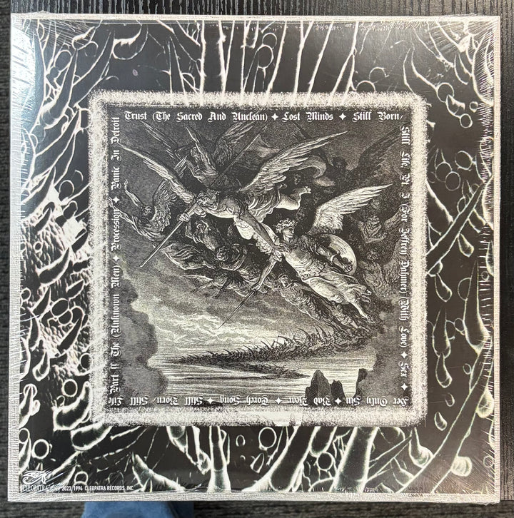 CHRISTIAN DEATH - Rage Of Angels cover with a central illustration of an angel and devil, surrounded by intricate patterns.