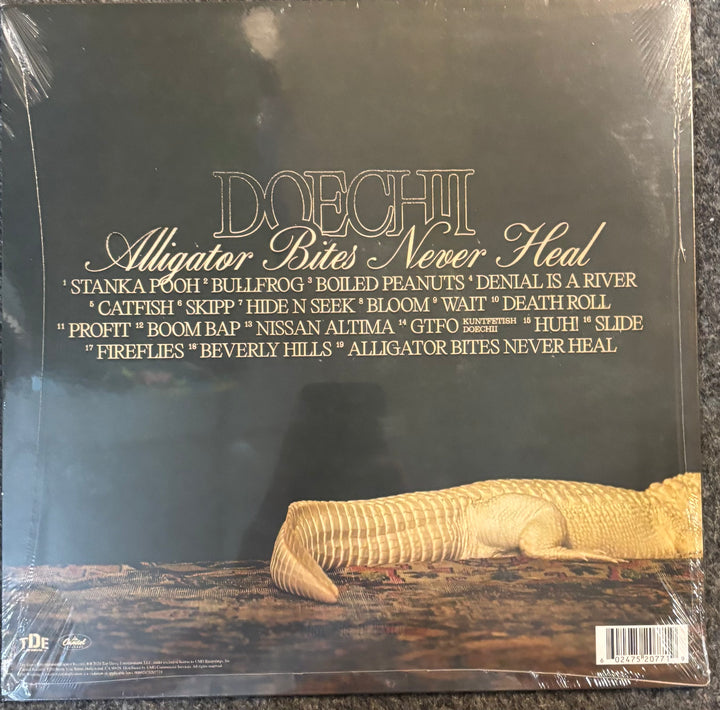 Back cover of Doechii - Alligator Bites Never Heal with text and a lizard illustration.