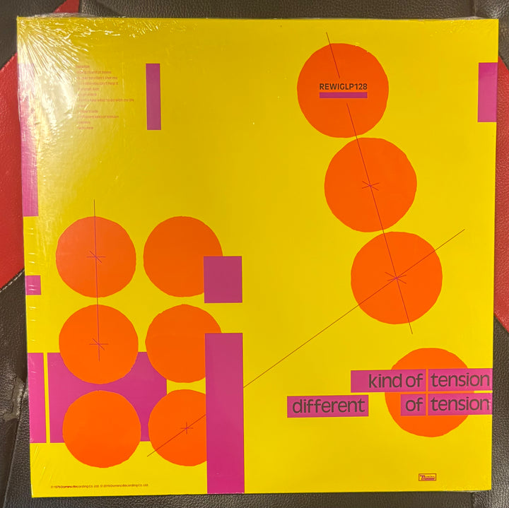 BUZZCOCKS - A Different Kind Of Tension Vinyl record cover with geometric design and text on a yellow background