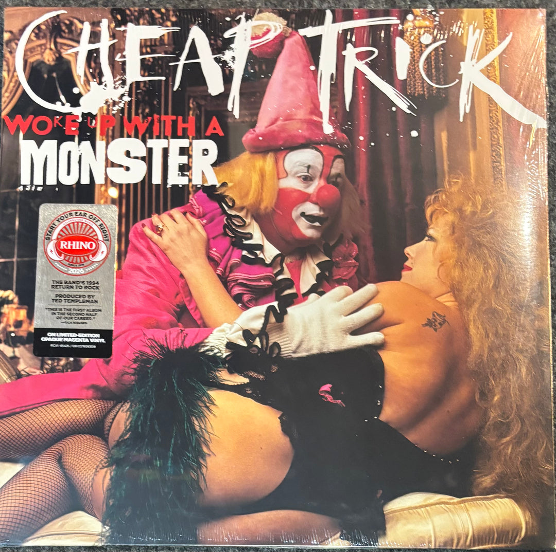 Vinyl record cover for Cheap Trick - Woke Up With A Monster, featuring a clown in a pink suit and hat embracing a woman in black lingerie, with a Rhino Square 4 sticker on the left.