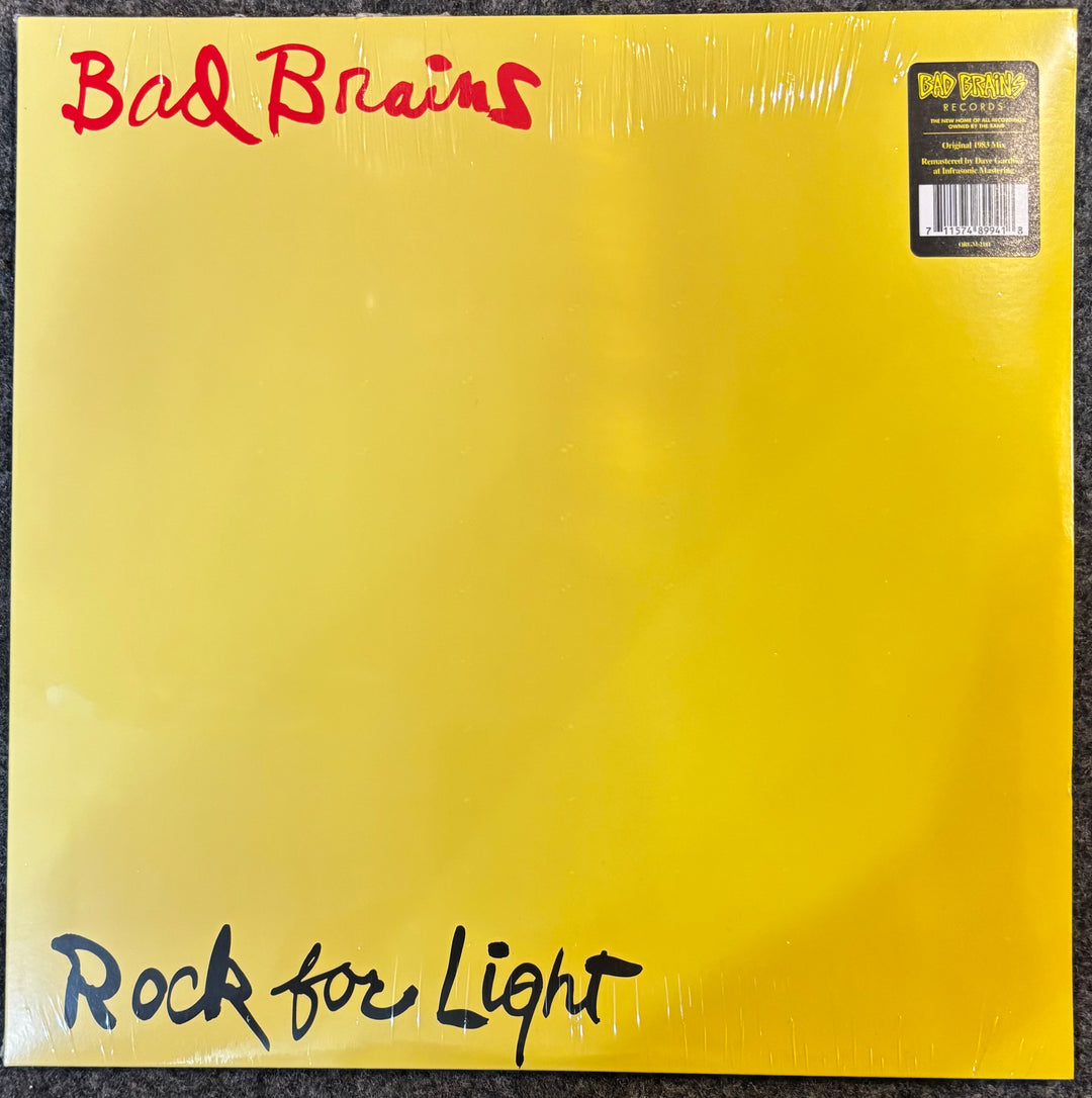 Vinyl record cover with 'Bad Brains' and 'Rock for Light' text on a yellow background