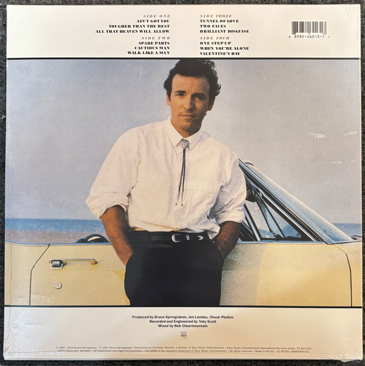 SPRINGSTEEN, BRUCE – Tunnel Of Love cover with a person sitting on a car by the beach
