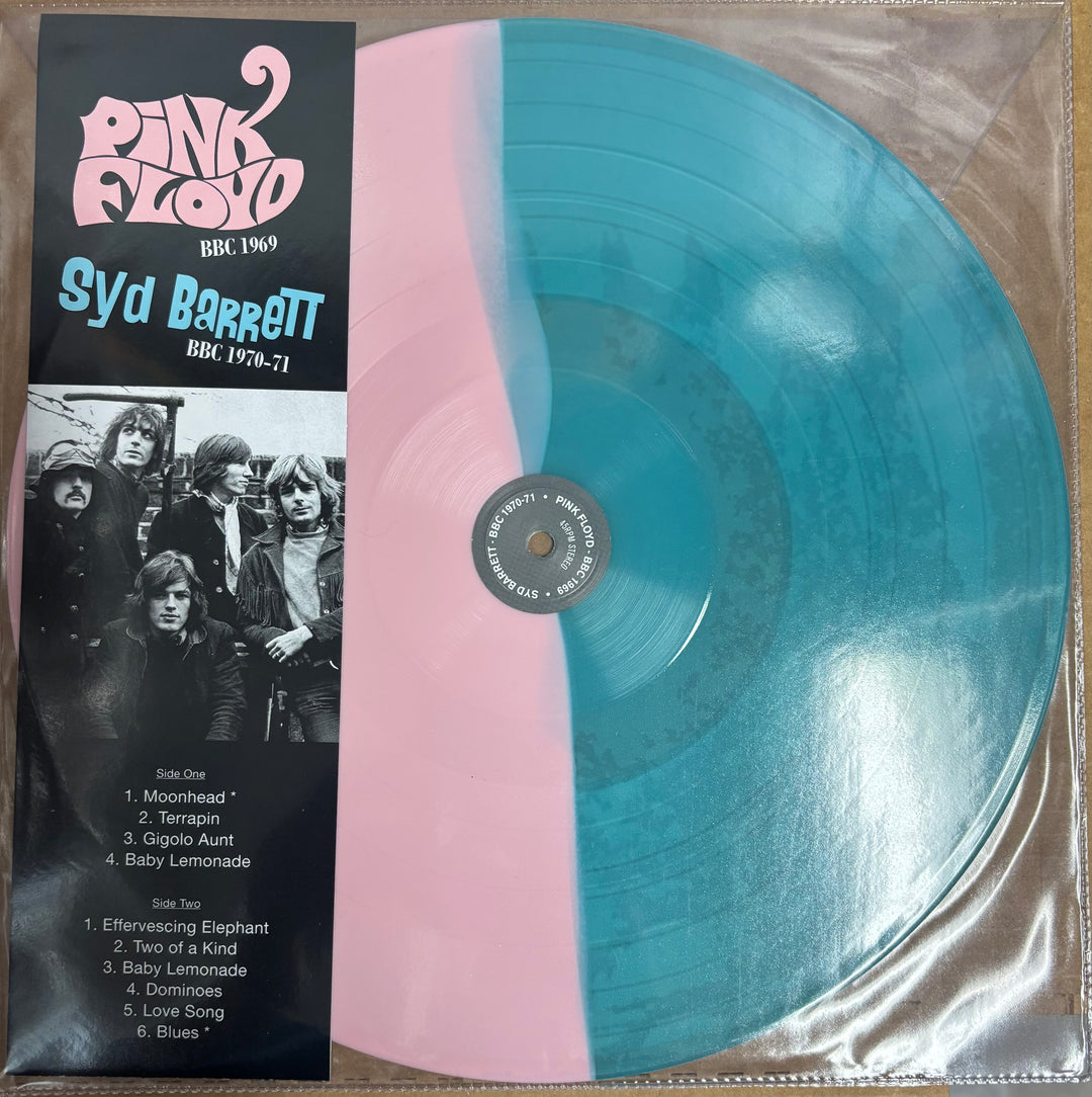 Vinyl record with pink and blue color scheme and cover featuring Pink Floyd and Syd Barrett.