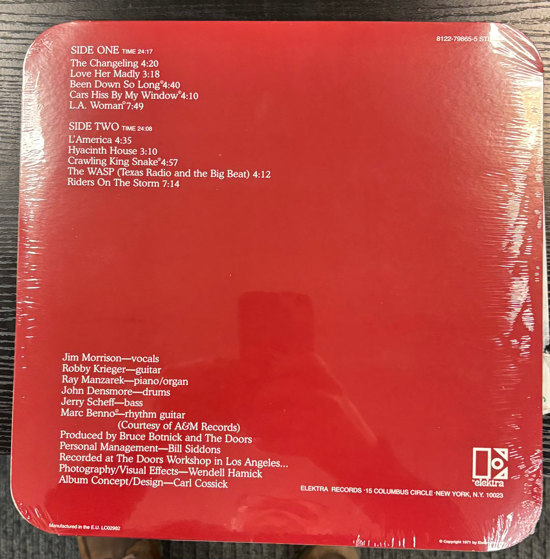 Back cover of DOORS, THE - L.A. Woman with text and album design elements.