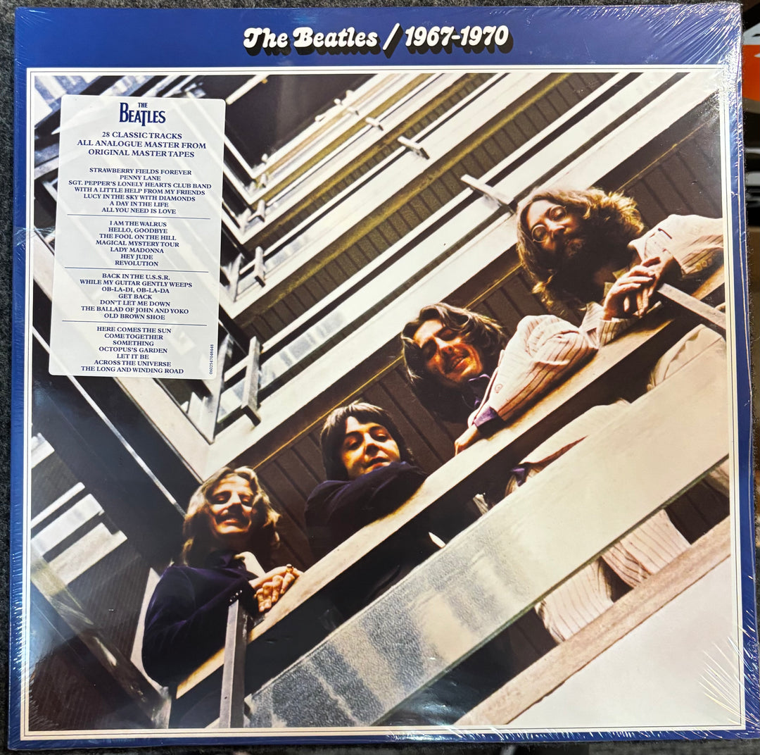 Album cover of 'The Beatles 1967-1970' featuring four band members on a staircase.