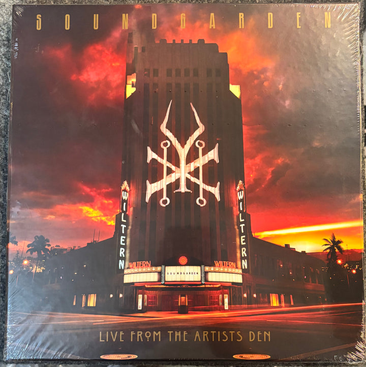 Vinyl record cover for Soundgarden's 'Live from the Artists Den' with a theater and sunset design.