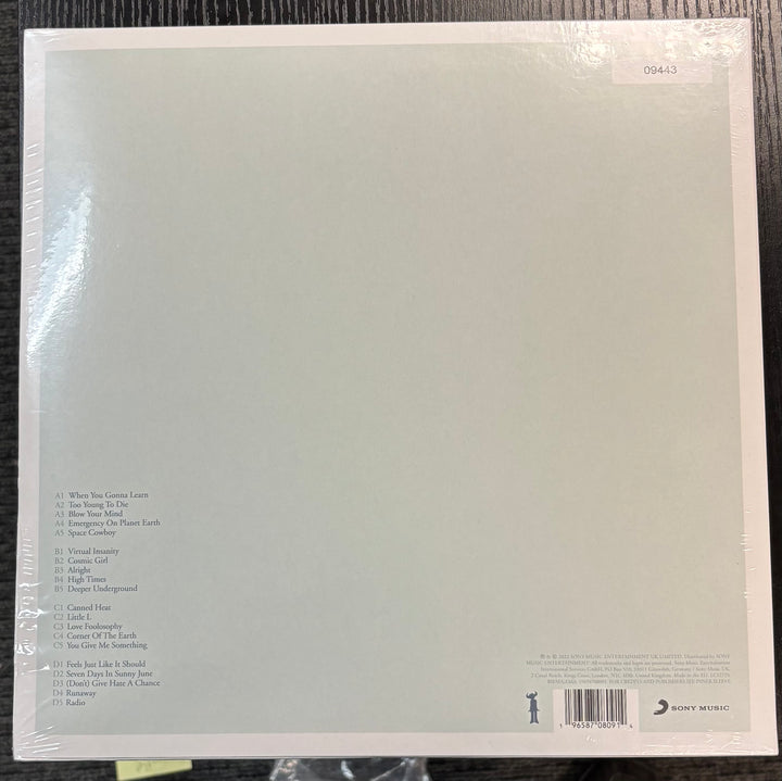 Back cover of JAMIROQUAI – High Times with text and a barcode on a black surface