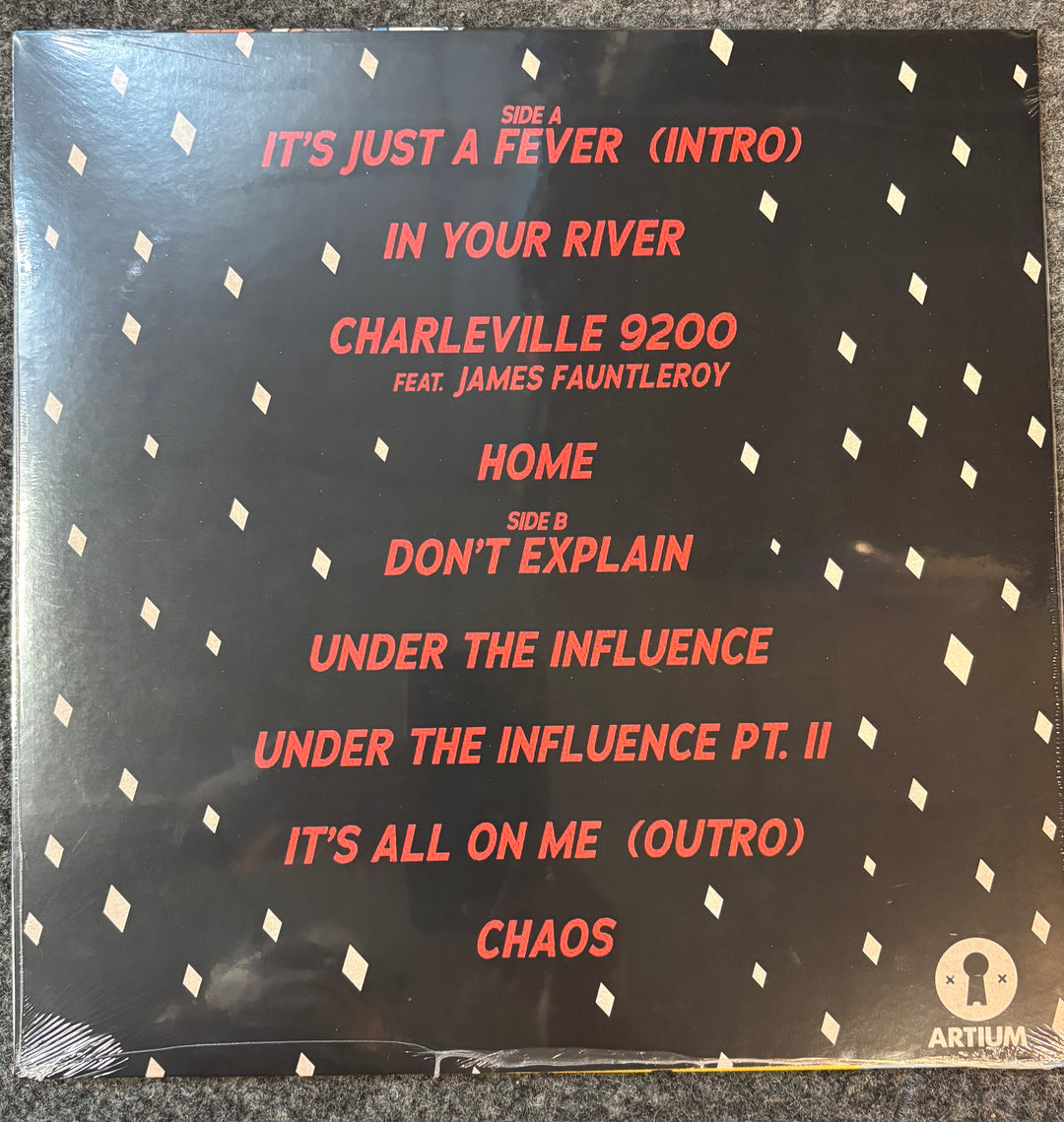Snoh Aalegra Don't Explain vinyl record sleeve with track listing on a textured surface